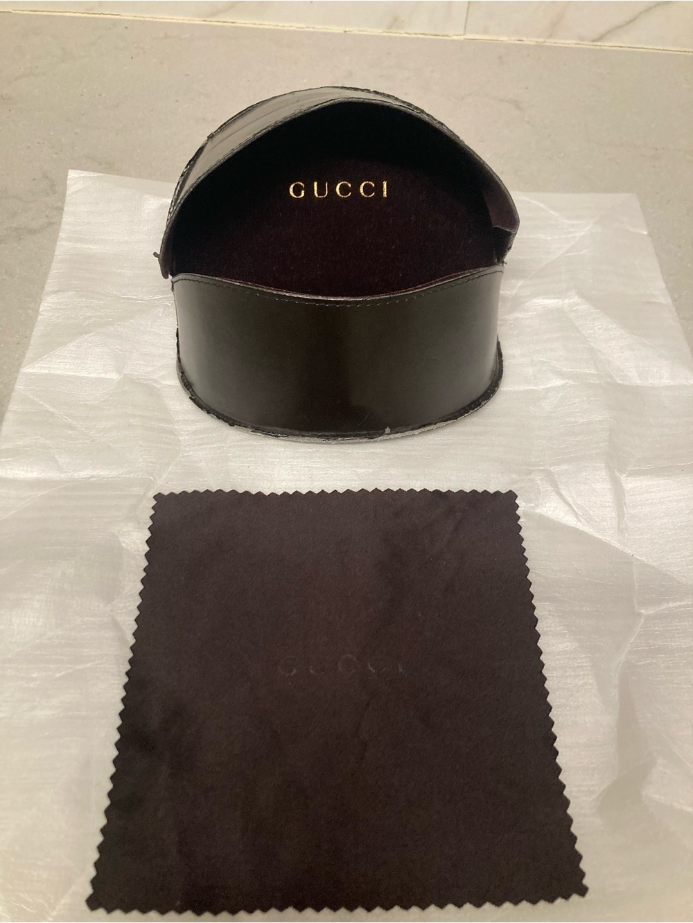 Black Authentic Gucci sunglasses case.
